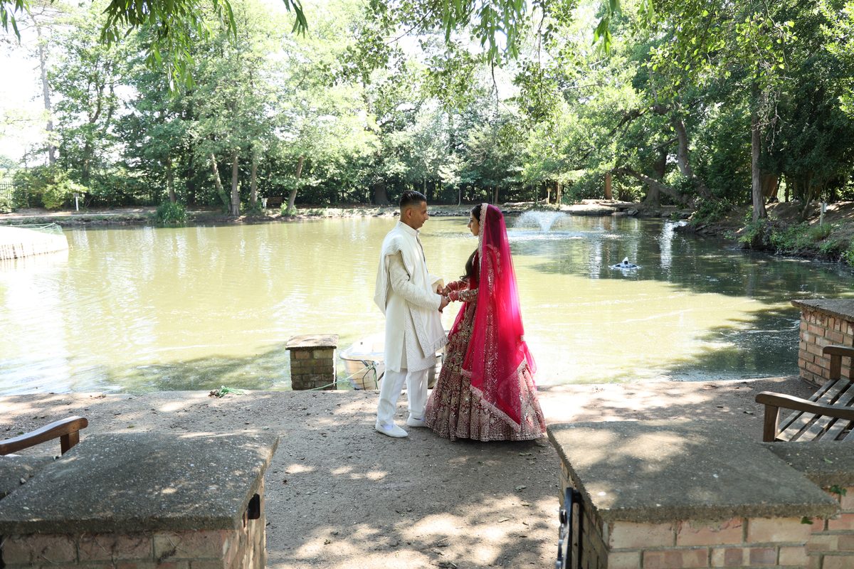 Asian wedding photographer at work during a ceremony