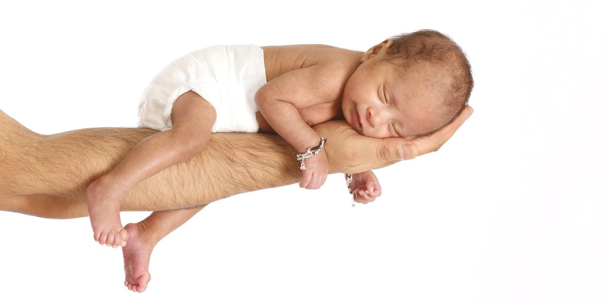 Sleeping newborn during a gentle studio session