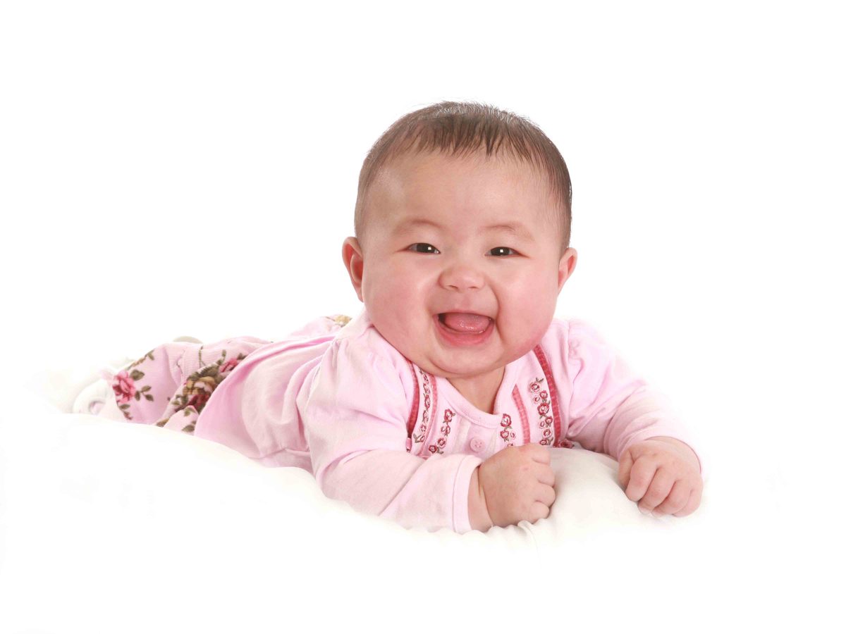 Happy baby mid-session during a relaxed studio shoot