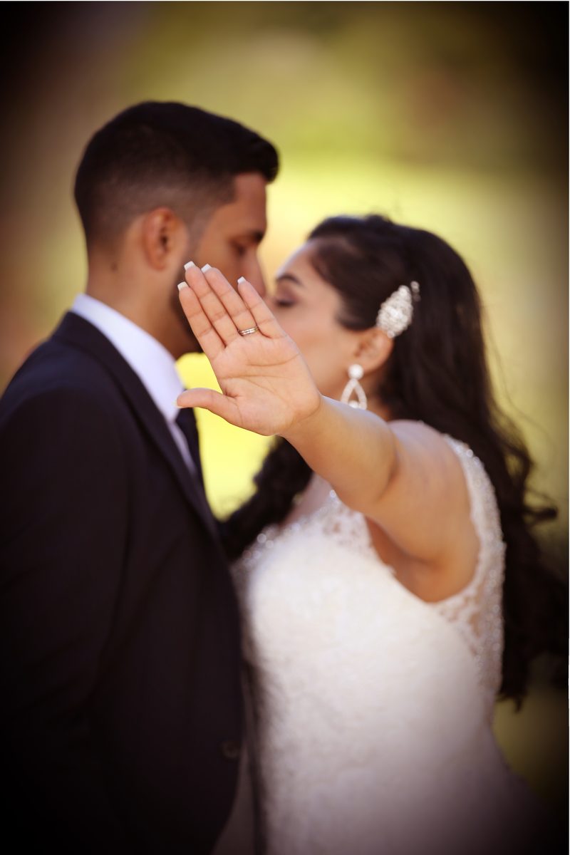 Couple sharing a natural, candid moment during portraits